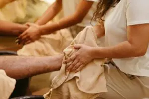 Calming foot spa scene with therapists pampering clients, focusing on relaxation and wellness.