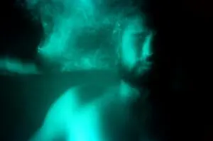 An evocative underwater portrait featuring light effects and motion blur.
