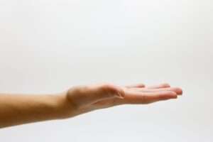 Detailed close-up of an open human hand on a white background, emphasizing gestures and expressions.