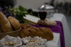 a table topped with bread and other foods